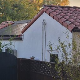 Roof with solar panel integration in progress