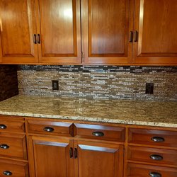MK Maintenance - Backsplash using glass and stone mosaics.