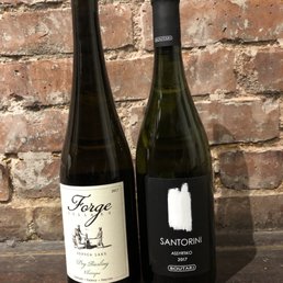 two bottles of wine on a table two bottles of wine on a table