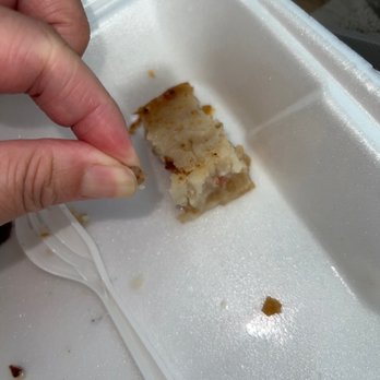 Pacific Lighthouse Restaurant - A pebble or rock in my turnip cake!! You can tell it's a hard object as I'm pressing it between my fingers!! - Dim Sum Near Me - Alameda, California Pacific Lighthouse Restaurant - A pebble or rock in my turnip cake!! You can tell it's a hard object as I'm pressing it between my fingers!! - Dim Sum Near Me - Alameda, California
