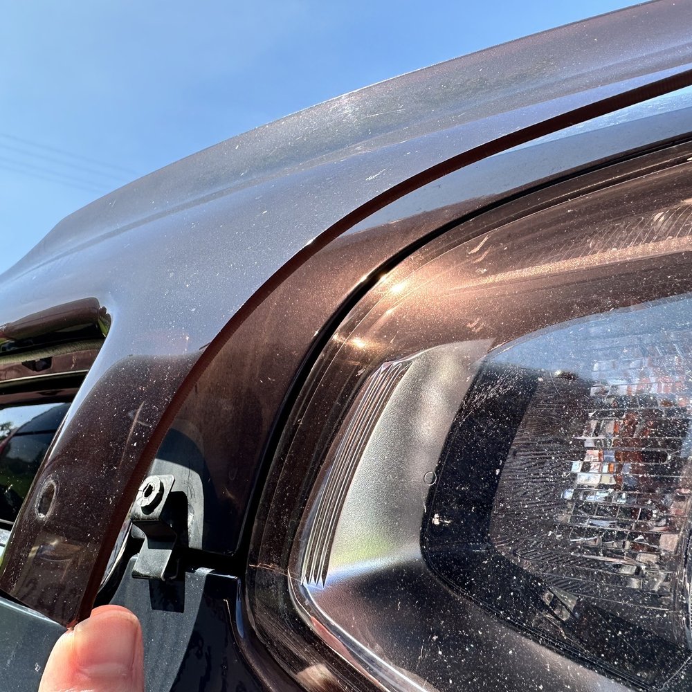Deflector ripped off, screw that held in place missing.