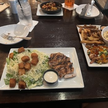 Stockyard Burgers & Bones - Chicken Caesar salad, bourbon chicken with fries and macaroni. - American Near Me - Atlanta, Georgia Stockyard Burgers & Bones - Chicken Caesar salad, bourbon chicken with fries and macaroni. - American Near Me - Atlanta, Georgia