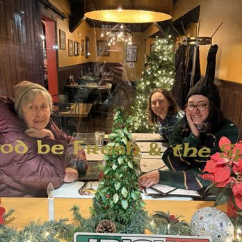 The Dunn Bar - Cozy nook by the window in the dining room, close enough to hear the live music but able to enjoy conversation - Irish Pub Near Me - Biddeford, Maine