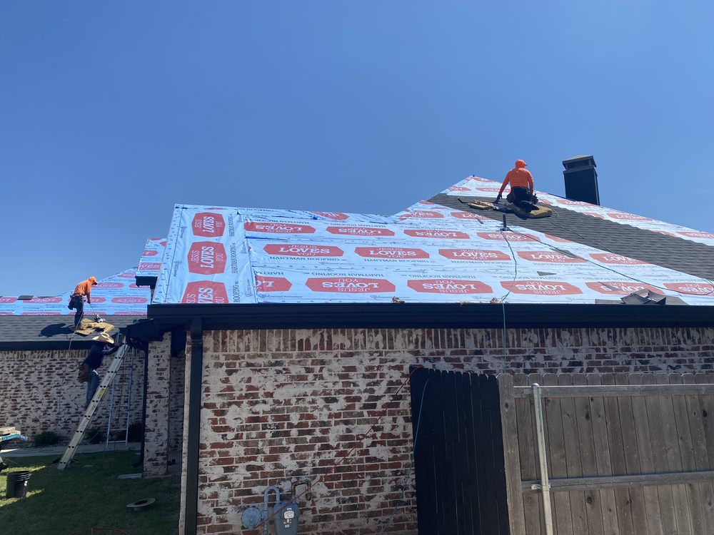 Slide of Hartman Roofing