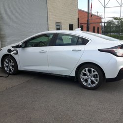 Green Tree Auto Care - Electric vehicle service and a charging station.