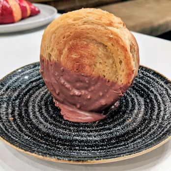 Catch 122 - 11/25/22 Hazelnut Praline Kouign Amann - Hazelnut Praline, Croissant Roll, Feuilletine, Hazelnut Pastry Cream, Chocolate Drizzle - Breakfast & Brunch Near Me - North Vancouver, British Columbia