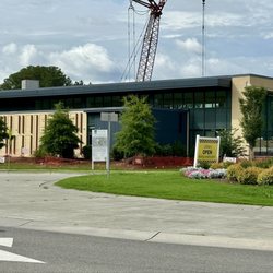 Morrisville Community Library - The sign says "Library OPEN During Construction" as viewed from the adjacent traffic circle, July 2026.