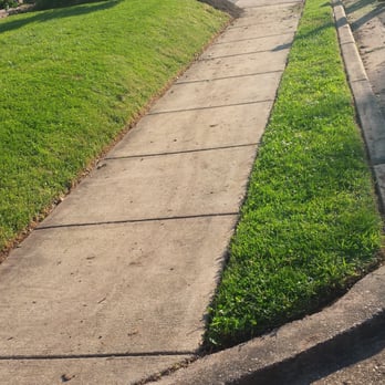 Lawnsy - a sidewalk in a residential neighborhood - Gutter Services Near Me Lawnsy - a sidewalk in a residential neighborhood - Gutter Services Near Me
