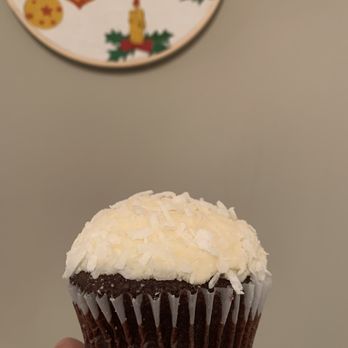 Flirt Cupcakes - a hand holding a cupcake - Desserts Near Me - Edmonton, Alberta