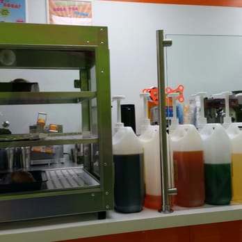 Boba World - On left is some of the bread items they sell and on the right is the syrups used for their boba tea. - Coffee & Tea Near Me - Miami, Florida