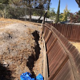 We had a fence that was falling over due to an elevation change between our house and our neighbors.