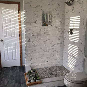 J.A.G.S Contracting - ws a bathroom with a marble shower - General Contractors Near Me