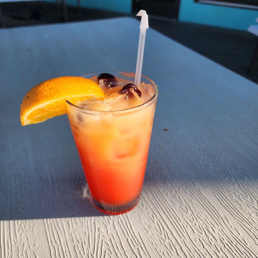 Lake Eustis Waterfront Grille - Tiki Torch Punch: Bacardi Rum, Peach, Fruit juices and grenadine - Seafood Near Me - Eustis, Florida Lake Eustis Waterfront Grille - Tiki Torch Punch: Bacardi Rum, Peach, Fruit juices and grenadine - Seafood Near Me - Eustis, Florida