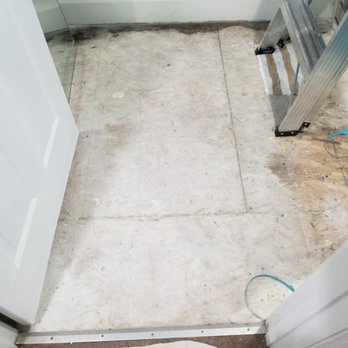 Exquisite Home Improvement - Bathroom flooring before - Flooring Near Me