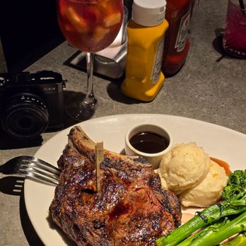 Yard House - 20oz Ribeye steak cooked medium rare - New American Near Me - Costa Mesa, California