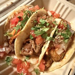 Left to right -- spicy beef, chicken, curry chicken tacos Left to right -- spicy beef, chicken, curry chicken tacos