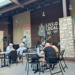 Fable playing classic rock on the patio. Yes, it's a grocery store too!