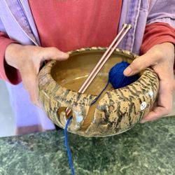 Mill Creek Pottery - Gail holding pottery knitting bowl.