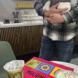 Half dozen donuts and two boba teas