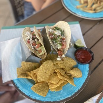 Fins Bar And Chill - a plate of tacos and chips - Bars Near Me - Pigeon Forge, Tennessee