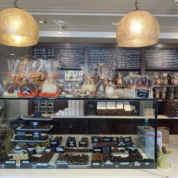 Bethesda Chocolates - Chocolate display featuring the menu board - Chocolatiers & Shops Near Me - Bethesda, Maryland Bethesda Chocolates - Chocolate display featuring the menu board - Chocolatiers & Shops Near Me - Bethesda, Maryland