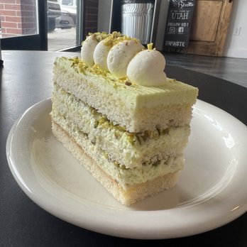 Biscotts Bakery & Cafe - Pistachio cake slice - Cafes Near Me - South Jordan, Utah Biscotts Bakery & Cafe - Pistachio cake slice - Cafes Near Me - South Jordan, Utah