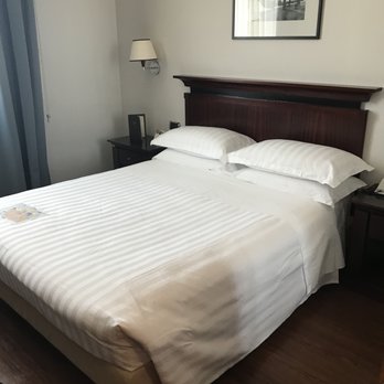 Starhotels Excelsior - Basic bed, clean and soft linens. Loved the extra pillows, a rarity in Europe! - Hotels Near Me - Bologna, BO