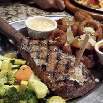 Saddle Ranch - Rib-eye with onion rings - Steakhouses Near Me - Orange, California Saddle Ranch - Rib-eye with onion rings - Steakhouses Near Me - Orange, California