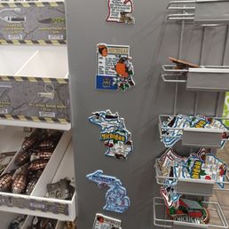 a refrigerator with stickers on it a refrigerator with stickers on it