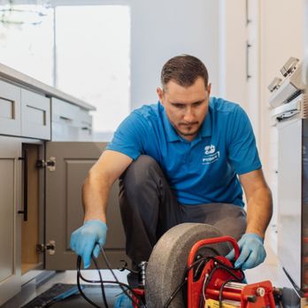 Pipedex Plumbing and Drains - Technician is working on clearing a blockage in the kitchen sink drain - Plumbing Near Me - Roebuck, South Carolina Pipedex Plumbing and Drains - Technician is working on clearing a blockage in the kitchen sink drain - Plumbing Near Me - Roebuck, South Carolina