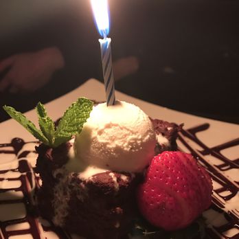 DiWine - Birthday candle on the chocolate pecan cake amazing! - Wine Bars Near Me - Astoria, New York DiWine - Birthday candle on the chocolate pecan cake amazing! - Wine Bars Near Me - Astoria, New York
