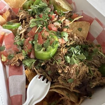 Jackalope's Bar and Grill - Carnitas nachos (minus sour cream). It may not look like it, but this was pretty heavy, like I was carrying a cake. - American Near Me - Fish Camp, California Jackalope's Bar and Grill - Carnitas nachos (minus sour cream). It may not look like it, but this was pretty heavy, like I was carrying a cake. - American Near Me - Fish Camp, California
