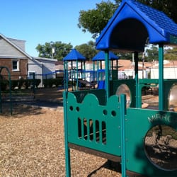Kiddie Korral Park - Small and big play structures, two sets of swings