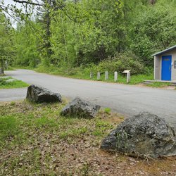 Hidden Lake Campground - Pit toilets near the boat dock and campsites by the lake