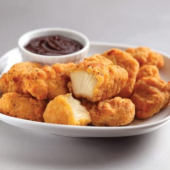 Domino's Pizza - a plate of chicken nuggies with dipping sauce - Pizza Near Me - Chateauguay, Quebec Domino's Pizza - a plate of chicken nuggies with dipping sauce - Pizza Near Me - Chateauguay, Quebec