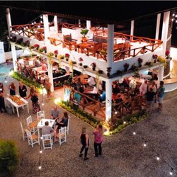 Jack´s Cantina - Two stories building and large patio with tables and chairs