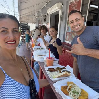 Sandy's Cafe - Seating with street view. Tostones, ropa vieja plate and a papaya water drink with cafe "cortadito" - Cuban Near Me - Key West, Florida Sandy's Cafe - Seating with street view. Tostones, ropa vieja plate and a papaya water drink with cafe "cortadito" - Cuban Near Me - Key West, Florida