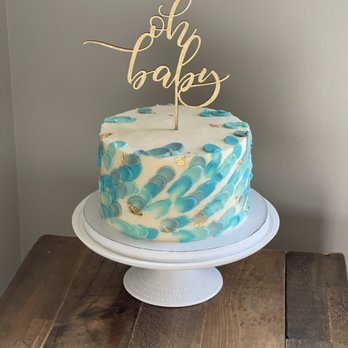 Cake As Canvas - a blue and white cake with a gold topper - Bakeries Near Me - Bethlehem, Pennsylvania