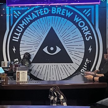 Illuminated Brew Works - a man sitting at a bar - Brewpubs Near Me - Chicago, Illinois Illuminated Brew Works - a man sitting at a bar - Brewpubs Near Me - Chicago, Illinois