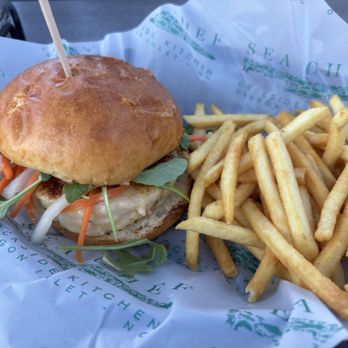 Sea Chef Dockside Kitchen - Shrimp burger is made with large whole shrimp and is nestled in a basket with perfectly crispy fries. - Seafood Near Me - Nags Head, North Carolina Sea Chef Dockside Kitchen - Shrimp burger is made with large whole shrimp and is nestled in a basket with perfectly crispy fries. - Seafood Near Me - Nags Head, North Carolina