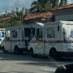 USPS - Four mail trucks blocking access to our mail room.