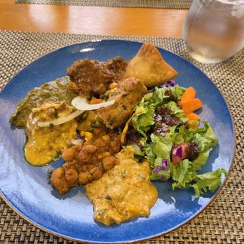 Tatva Indian Fine Dining - Here is my plate of samosas, various curry dishes, salad and lamb curry. - Indian Near Me - Anaheim, California Tatva Indian Fine Dining - Here is my plate of samosas, various curry dishes, salad and lamb curry. - Indian Near Me - Anaheim, California