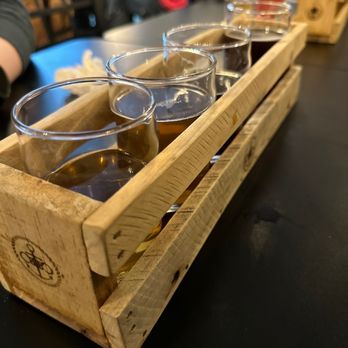 Capstan Bar Brewing Company - a flight of beer in a wooden crate - Breweries Near Me - Hampton, Virginia Capstan Bar Brewing Company - a flight of beer in a wooden crate - Breweries Near Me - Hampton, Virginia