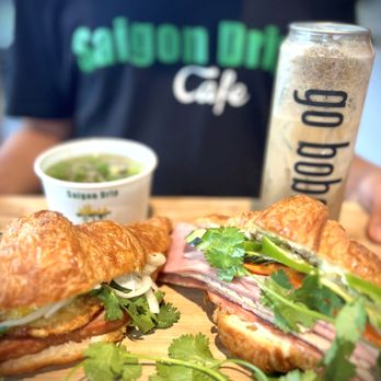 Saigon Drip Cafe - Croissant Mì (Spam Slammin Egg + Cult Cut Classic)
Phở beef bone broth + Vietnamese Coffee - Vietnamese Near Me - Seattle, Washington Saigon Drip Cafe - Croissant Mì (Spam Slammin Egg + Cult Cut Classic)
Phở beef bone broth + Vietnamese Coffee - Vietnamese Near Me - Seattle, Washington