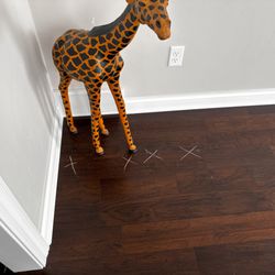 D & M Flooring America - White chalked Xs denotes floors lifting.
