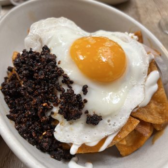 Oxomoco - A simple dish that's elevated with crispy garlic and chili sauce and crema - Mexican Near Me - Brooklyn, New York Oxomoco - A simple dish that's elevated with crispy garlic and chili sauce and crema - Mexican Near Me - Brooklyn, New York