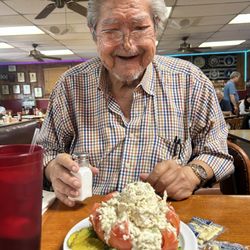 One of our regulars enjoying a stuffed tomato chicken salad.