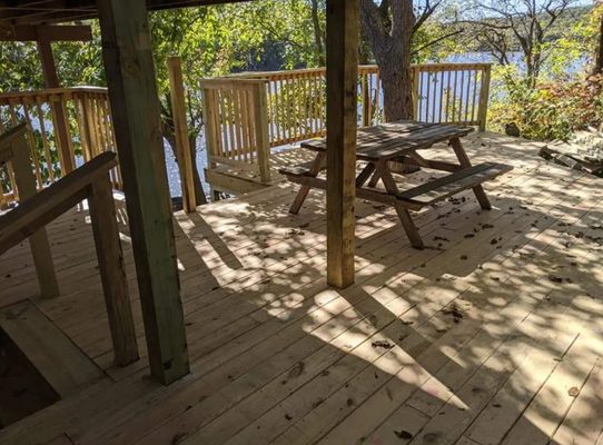 Cliffside Deck - We built this custom deck, built on and formed around shelf rock on a cliff.   Call us to build a custom deck for you!