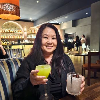Chelsea - American Samurai in righthand and mocktail in lefthand - New American Near Me - Santa Monica, California