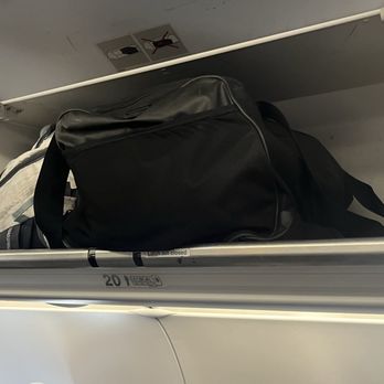 Frontier Airlines - This is to show the space that was left for my small carry on - Airlines Near Me - Denver, Colorado